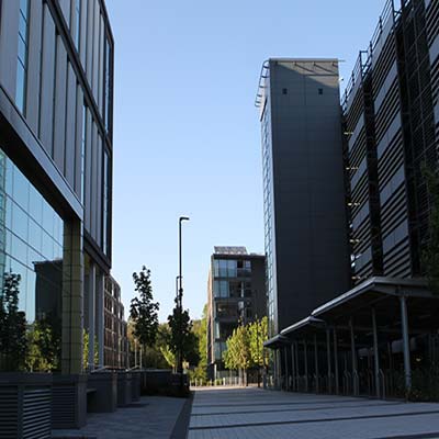 Low perspective down a street of modern commercial buildings