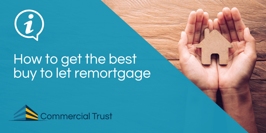 Blue banner with text "How to get the best buy to let remortgage" in front a photo of a pair of hands holding a wooden house