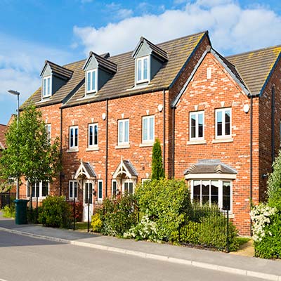 Modern town houses with railing fronted tidy gardens