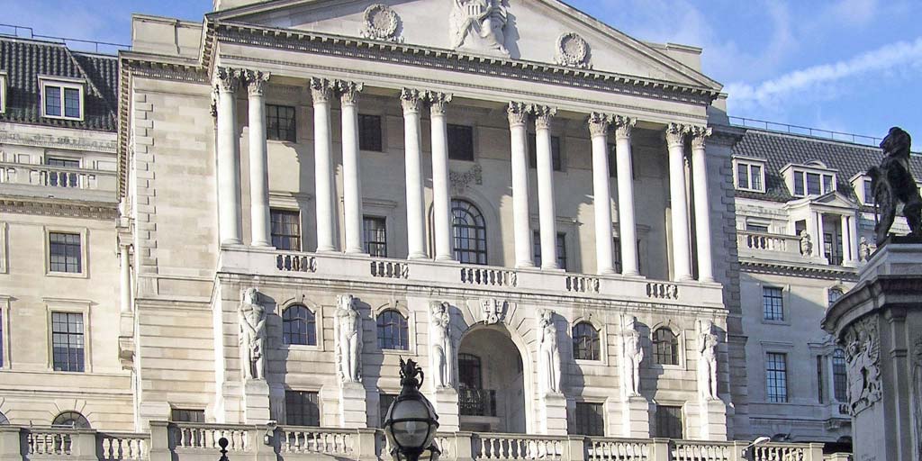 Bank of England against bright blue cloudy sky