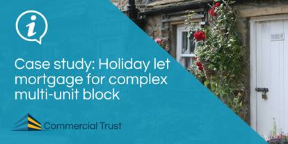Blue banner with white text "Holiday let mortgage for complex multi-unit block" with traditional holiday cottage in background, white front door, red rose growing around it