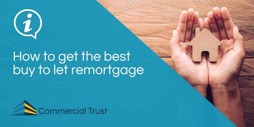 Blue banner with text "How to get the best buy to let remortgage" in front a photo of a pair of hands holding a wooden house